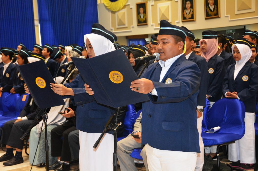postgraduate taking oath