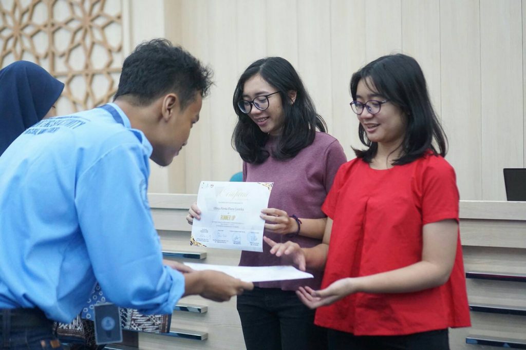From the right: Devi Salsabila and Olivia Firsta received the award for winning 2nd Place SEADC Champion at Muhammadiyah University in Yogyakarta.