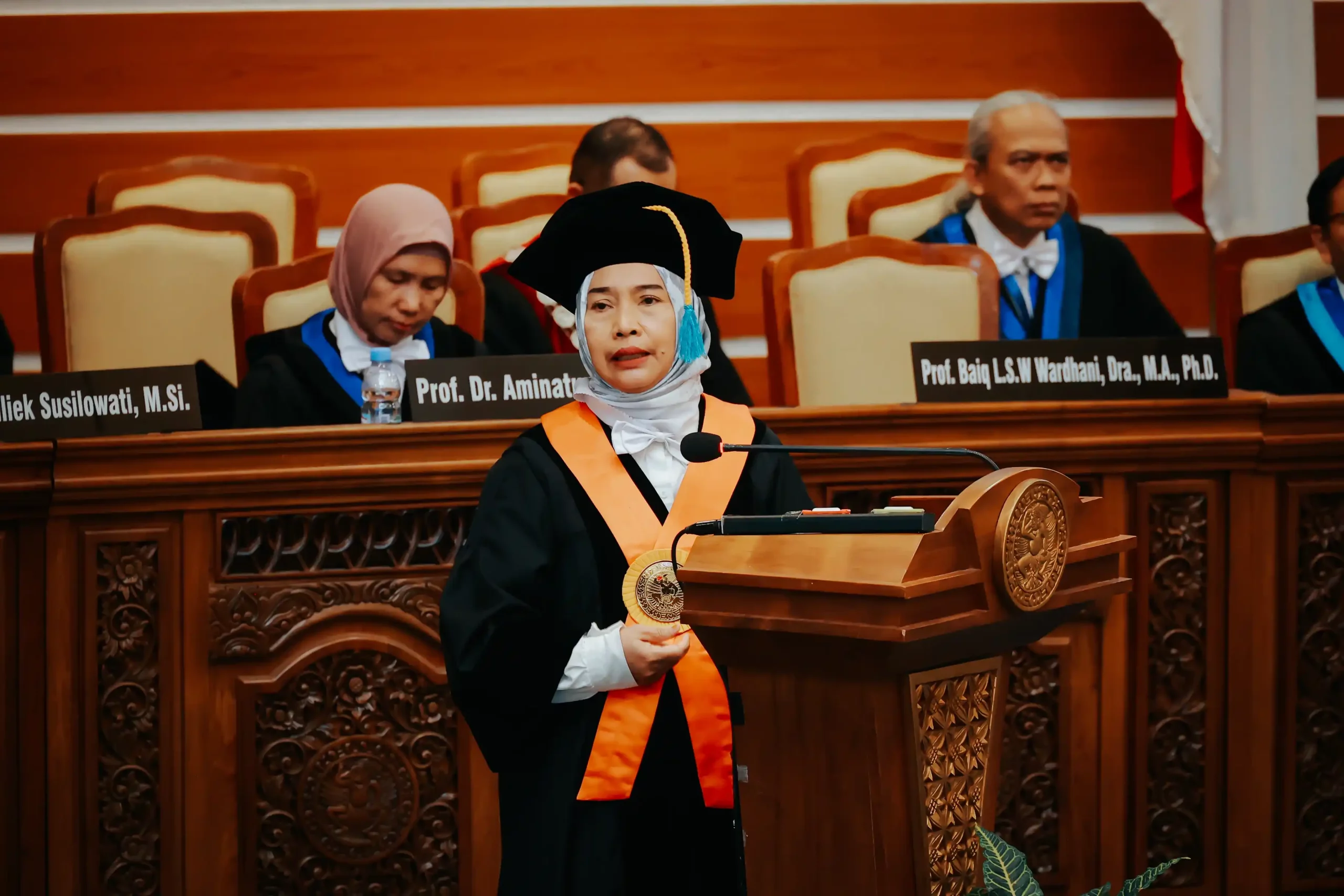 Prof Wardhani delivers her oration on the podium