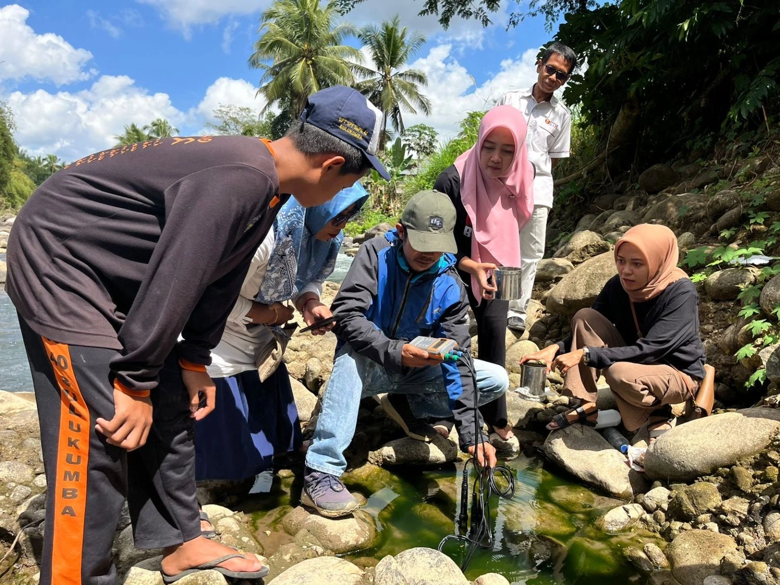 Some people in riverside testing water quality
