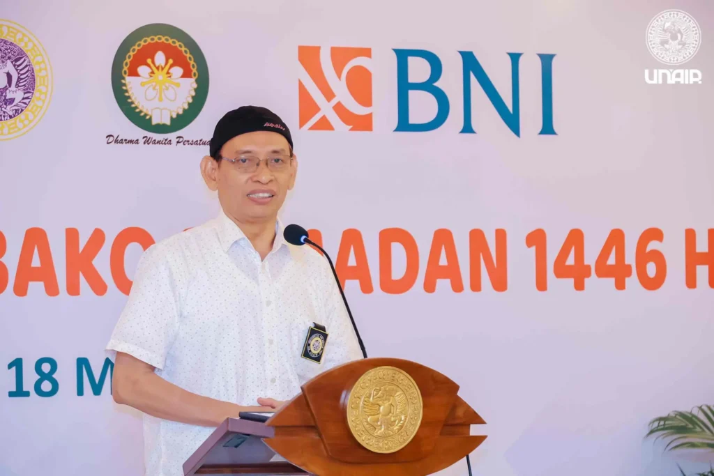 UNAIR Rector Prof. Dr. Mohammad Nasih MT Ak CA delivers remarks at the DWP and BNI social charity event distributing staple food packages. (Photo: PKIP UNAIR)