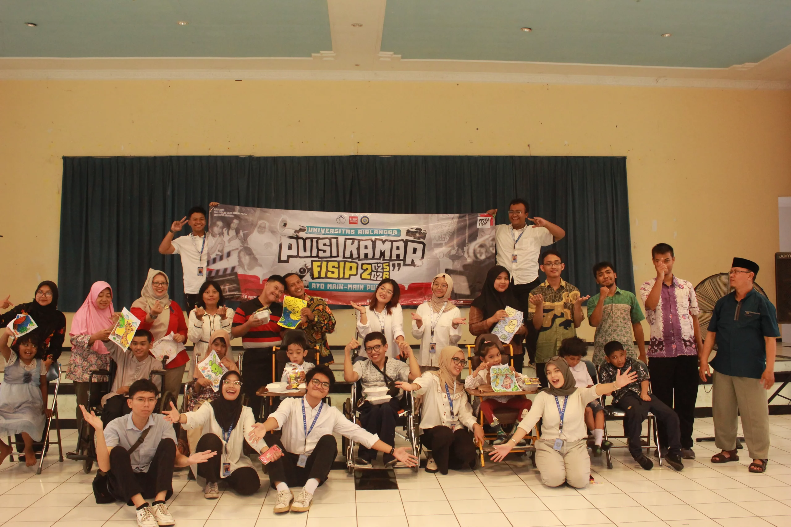 Members of BSO PUSKA pose for a group photo with children from the Foundation for the Development of Disabled Children (YPAC) on Friday, May 23, 2025. (Photo: By courtesy)