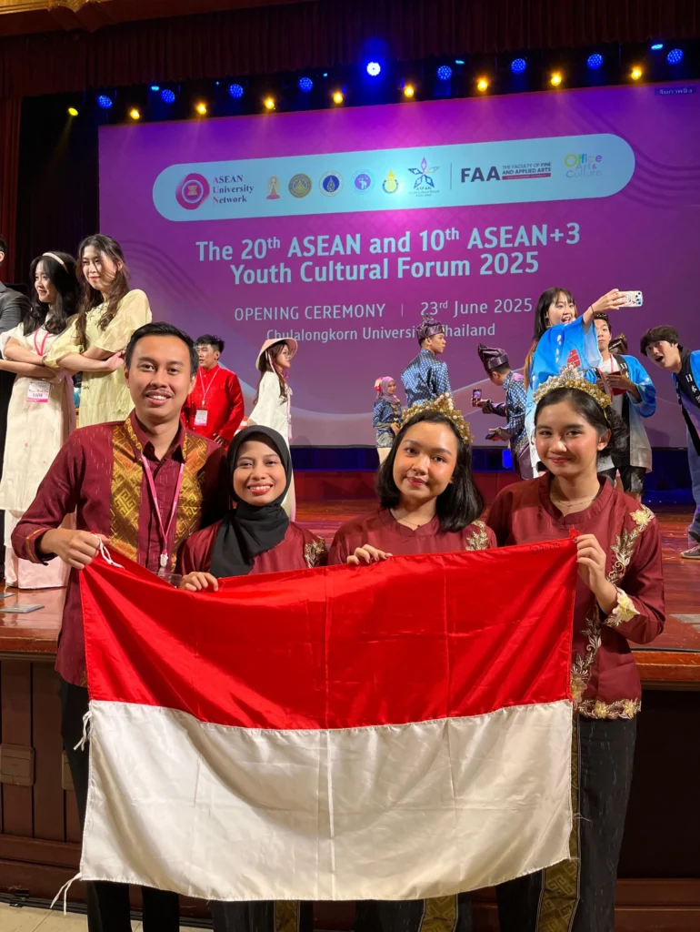 UNAIR delegation proudly unfurled the Indonesian flag after their performance at the opening ceremony of AYCF+3 2025 at Chulalongkorn University, Thailand, where they represented Indonesia as the nation’s sole delegate. (Photo: UNAIR Delegation)