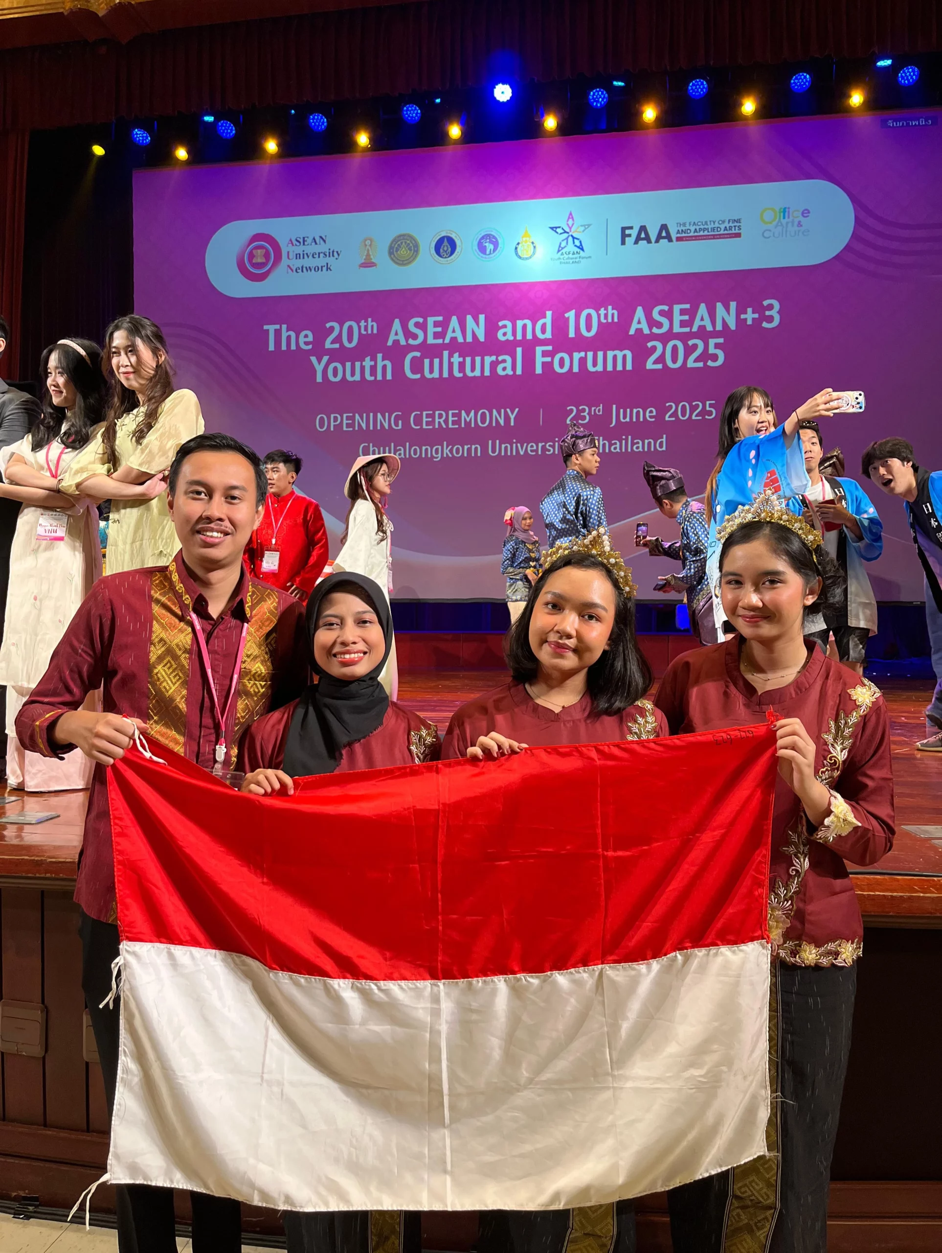 UNAIR delegation proudly unfurled the Indonesian flag after their performance at the opening ceremony of AYCF+3 2025 at Chulalongkorn University, Thailand, where they represented Indonesia as the nation’s sole delegate. (Photo: UNAIR Delegation)
