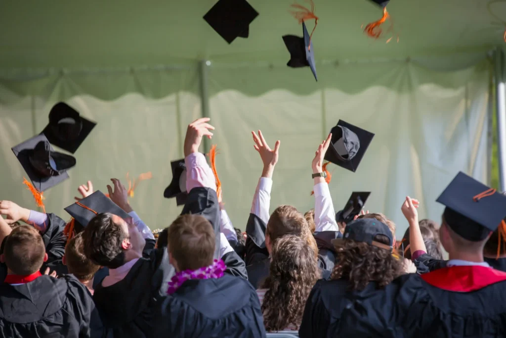 Illustration of graduates celebrating in academic regalia (Photo: Pexels)