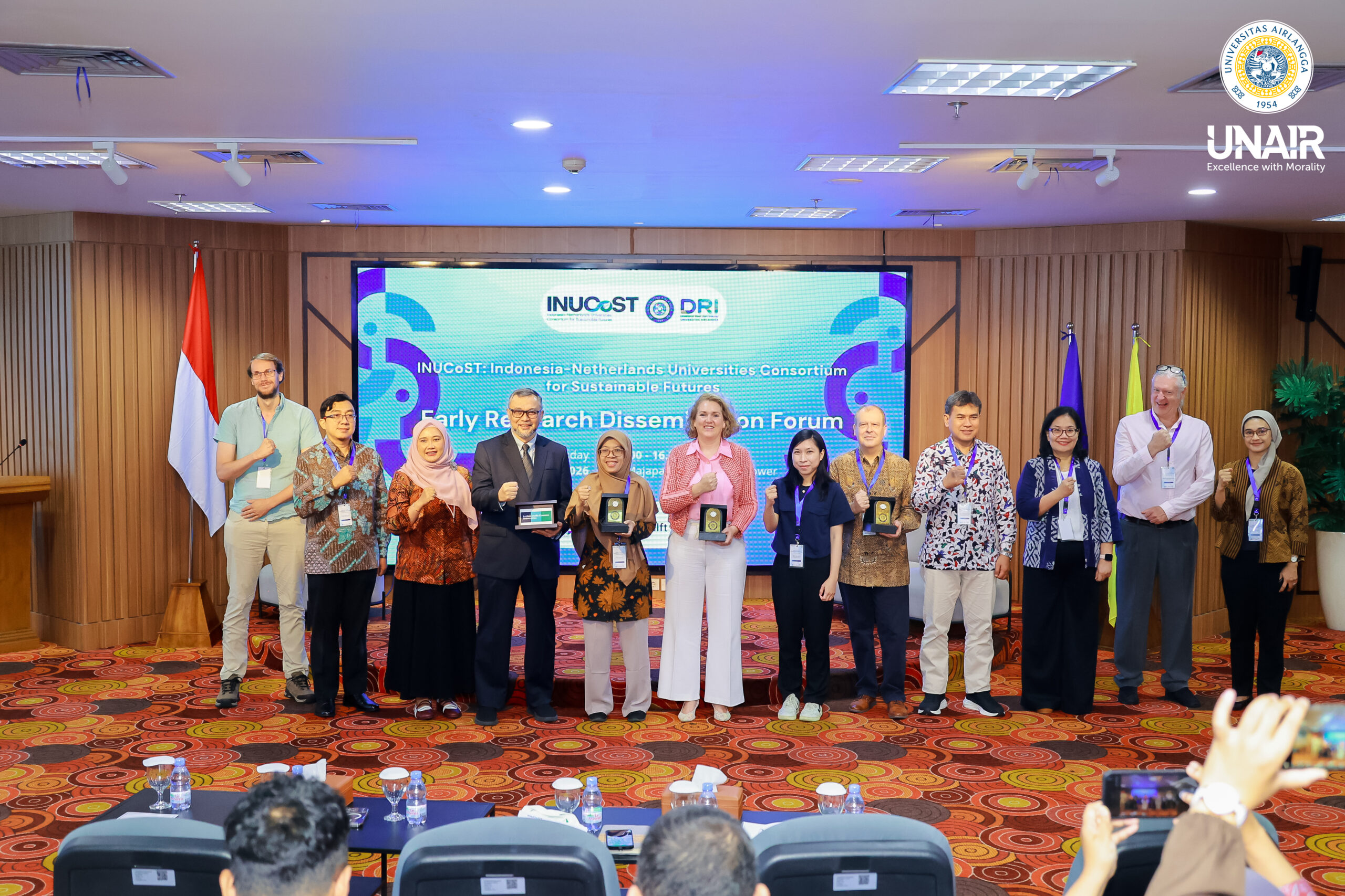 A group photo session featuring UNAIR executives alongside representatives from the Embassy of the Kingdom of the Netherlands and the Ministry of Higher Education, Science, and Technology at the opening ceremony of the INUCoST event series on Monday, June 29, 2026. (Photo: PHMP UNAIR)